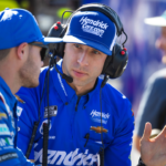 Crew chief Cliff Daniels (right) talks with NASCAR Cup Series driver Kyle Larson during qualifying for the NASCAR Championship Race at Phoenix Raceway.