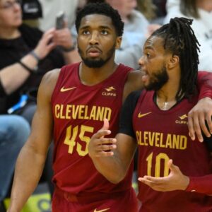 Cleveland Cavaliers guard Donovan Mitchell (45) and guard Darius Garland (10) talk in the fourth quarter against the Indiana Pacers at Rocket Mortgage FieldHouse.