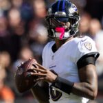 Oct 27, 2024; Cleveland, Ohio, USA; Baltimore Ravens quarterback Lamar Jackson (8) looks for a receiver downfield against the Cleveland Browns during the second quarter at Huntington Bank Field.