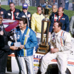 NASCAR Grand National Series driver Bobby Allison (left) receives the most popular driver award as A.J. Foyt (right) celebrates in victory lane after winning the inaugural 1971 Miller High Life 500 at Ontario Motor Speedway.