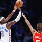 Oklahoma City Thunder guard Shai Gilgeous-Alexander (2) shoots a three point basket as Atlanta Hawks guard Dyson Daniels (5) defends during the second quarter at Paycom Center.