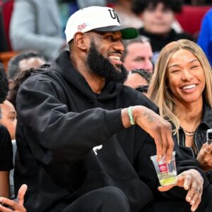 Los Angeles Laker LeBron James and his wife Savannah James sit court side at the McDonald's All American game during the first half at Toyota Center.
