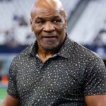 ; Boxer Mike Tyson on the field before the game between the Dallas Cowboys and New Orleans Saints at AT&T Stadium