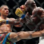 Alex Pereira (red gloves) fights Khalil Rountree Jr. (blue gloves) in a light heavyweight title bout during UFC 307 at Delta Center.