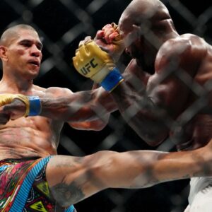 Alex Pereira (red gloves) fights Khalil Rountree Jr. (blue gloves) in a light heavyweight title bout during UFC 307 at Delta Center.