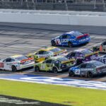 Oct 6, 2024; Talladega, Alabama, USA; Ryan Blaney (12) and Ross Chastain (1) are part of the lead pack seconds before their wreck in the final laps during the second stage of the YellaWood 500 at Talladega Superspeedway. Mandatory Credit: Vasha Hunt-Imagn Images