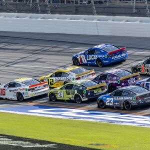 Oct 6, 2024; Talladega, Alabama, USA; Ryan Blaney (12) and Ross Chastain (1) are part of the lead pack seconds before their wreck in the final laps during the second stage of the YellaWood 500 at Talladega Superspeedway. Mandatory Credit: Vasha Hunt-Imagn Images