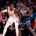 New York Knicks forward Julius Randle (30) controls the ball against Minnesota Timberwolves guard Anthony Edwards (5) during the first quarter at Madison Square Garden