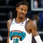 Oct 26, 2024; Memphis, Tennessee, USA; Memphis Grizzlies guard Ja Morant (12) looks on during the second half against the Orlando Magic at FedExForum. Mandatory Credit: Petre Thomas-Imagn Images