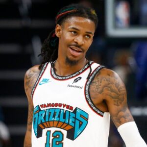Oct 26, 2024; Memphis, Tennessee, USA; Memphis Grizzlies guard Ja Morant (12) looks on during the second half against the Orlando Magic at FedExForum. Mandatory Credit: Petre Thomas-Imagn Images