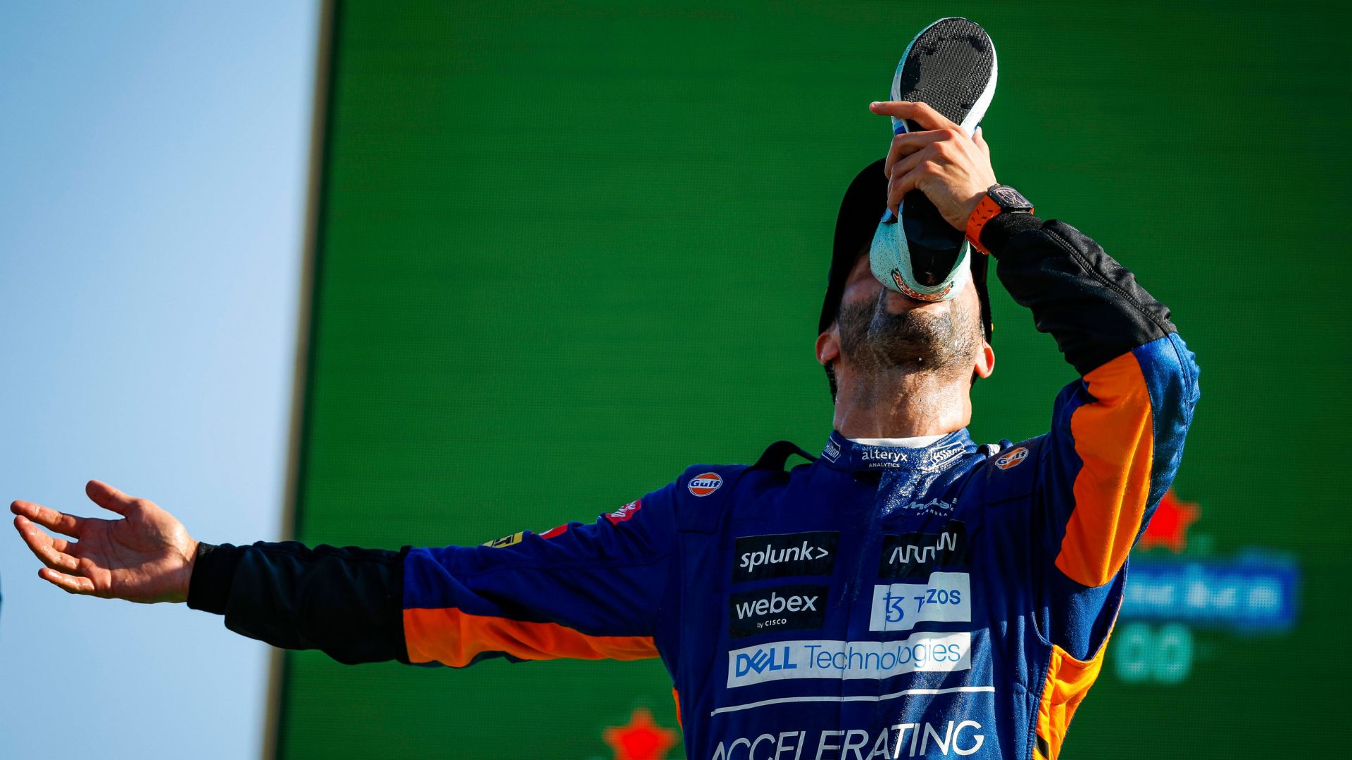 Daniel Ricciardo performing a shoey at the 2021 Italian GP