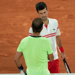 Novak Djokovic (SRB) at the net with Rafael Nadal (ESP) after their match on day 13 of the French Open at Stade Roland Garros.