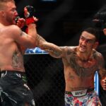 Max Holloway (blue gloves) fights Justin Gaethje (red gloves) during UFC 300 at T-Mobile Arena.