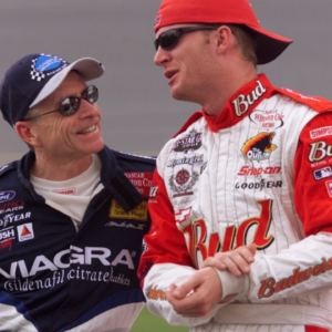Mark Martin talks with Dale Earnhardt Jr. just before their qualifying runs were called off due to rain Friday afternoon, July 6, 2001 at the Daytona International Speedway.