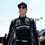 NASCAR Cup Series driver Carson Hocevar walks down pit lane prior to practice for the Cook Out Southern 500 at Darlington Raceway.