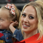 Oct 27, 2024; Paradise, Nevada, USA; Brittany Mahomes, the wife of Kansas City Chiefs quarterback Patrick Mahomes (15) holds daughter Sterling Mahomes during the game against the Las Vegas Raiders at Allegiant Stadium. Mandatory Credit: Kirby Lee-Imagn Images