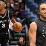 Chris Paul (L) and Tre Jones (R)