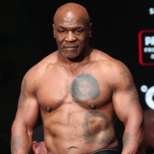 Mike Tyson weighs in the day before his fight against Jake Paul at the Toyota Music Factory.