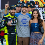 NASCAR Cup Series driver Ryan Blaney (left) celebrates with Chase Elliott (center) and Gianna Tulio after winning the 2023 NASCAR Cup Series Championship at Phoenix Raceway.