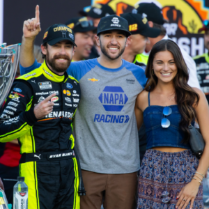 NASCAR Cup Series driver Ryan Blaney (left) celebrates with Chase Elliott (center) and Gianna Tulio after winning the 2023 NASCAR Cup Series Championship at Phoenix Raceway.