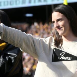 Iowa women’s basketball’s Caitlin Clark shows off her rings during a second quarter timeout during Iowa football’s game against Northwestern Saturday, Oct. 26, 2024 at Kinnick Stadium in Iowa City, Iowa.