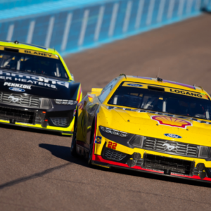 NASCAR Cup Series driver Joey Logano (22) leads teammate Ryan Blaney (12) during the NASCAR Cup Series Championship race at Phoenix Raceway.
