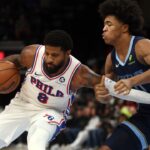 Philadelphia 76ers forward Paul George (8) drives to the basket as Memphis Grizzlies forward Jaylen Wells (0) defends during the first half at FedExForum.