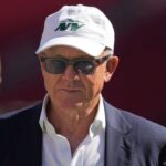 New York Jets owner Woody Johnson walks on the field before the game against the San Francisco 49ers at Levi's Stadium.