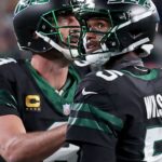 Aaron Rodgers and Garett Wilson