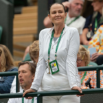 Former player and TV Commentator, Pam Shriver in attendance as coach for Donna Vekic of Croatia (not shown) during her match against Lulu Sun of New Zealand (not shown)