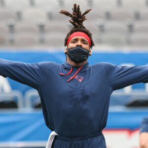 Aug 29, 2021; East Rutherford, New Jersey, USA; New England Patriots quarterback Cam Newton (1) warms up against the New York Giants before the game at MetLife Stadium.