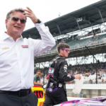 Five-time Brickyard 400 winner Jeff Gordon waits to talk with NASCAR Cup Series driver Alex Bowman (48) ahead of the Brickyard 400, Sunday, July 21, 2024, at Indianapolis Motor Speedway.