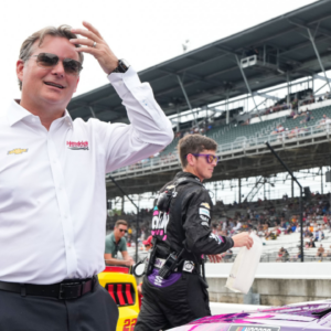 Five-time Brickyard 400 winner Jeff Gordon waits to talk with NASCAR Cup Series driver Alex Bowman (48) ahead of the Brickyard 400, Sunday, July 21, 2024, at Indianapolis Motor Speedway.