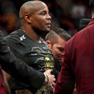 Daniel Cormier (blue gloves) celebrates beating Stipe Miocic (red gloves) during UFC 226 at T-Mobile Arena.