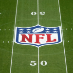The NFL shield logo at midfield during the 2024 NFL Munich Game at Allianz Arena.