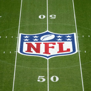 The NFL shield logo at midfield during the 2024 NFL Munich Game at Allianz Arena.