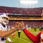 Buffalo Bills quarterback Josh Allen (17) shakes hands with Kansas City Chiefs quarterback Patrick Mahomes (15) after a game at GEHA Field at Arrowhead Stadium.