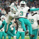 Miami Dolphins wide receiver Tyreek Hill (10) celebrates with wide receiver Odell Beckham Jr. (3) after scoring on a 1-yard touchdown reception against the Los Angeles Rams in the second half at SoFi Stadium.