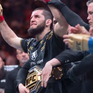 ; Islam Makhachev (red gloves) celebrates defeating Dustin Poirier (blue gloves) during UFC 302 at Prudential Center.