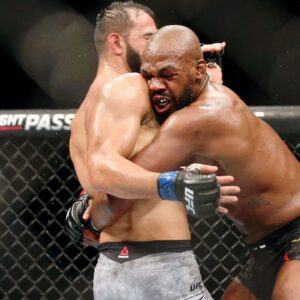Jon Jones (red gloves) fights Dominick Reyes (blue gloves) during UFC 247 at Toyota Center.
