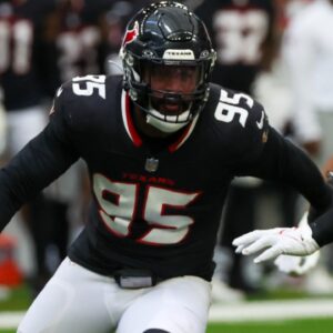 Aug 17, 2024; Houston, Texas, USA; New York Giants quarterback Daniel Jones (8) passes against Houston Texans defensive end Derek Barnett (95) rush in the first quarter at NRG Stadium.