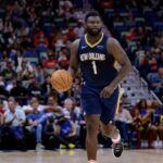 New Orleans Pelicans forward Zion Williamson (1) dribbles against the Cleveland Cavaliers during the first half at Smoothie King Center.