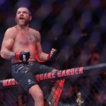 im Miller (red gloves) reacts after defeating Damon Jackson (blue gloves) in the lightweight bout during UFC 309 at Madison Square Garden.