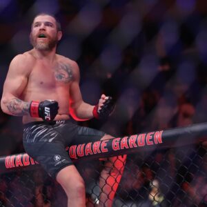 im Miller (red gloves) reacts after defeating Damon Jackson (blue gloves) in the lightweight bout during UFC 309 at Madison Square Garden.