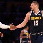 Denver Nuggets center Nikola Jokic (15) embraces guard Russell Westbrook (4) during the third quarter against the Los Angeles Lakers at Crypto.com Arena