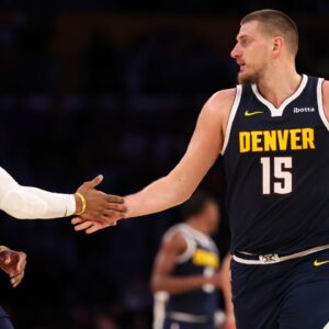 Denver Nuggets center Nikola Jokic (15) embraces guard Russell Westbrook (4) during the third quarter against the Los Angeles Lakers at Crypto.com Arena