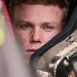 NASCAR Xfinity Series driver Riley Herbst (98) sits in his car Saturday, July 20, 2024, during qualifying for the Pennzoil 250 at Indianapolis Motor Speedway.