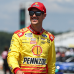 NASCAR Cup Series driver Joey Logano walks on pit road during practice and qualifying for the The Great American Getaway 400 at Pocono Raceway.