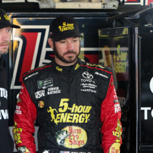 NASCAR Cup Series driver Martin Truex Jr (right) talks with his crew chief Cole Pearn (left) during practice for the Gander Outdoors 400 at Dover International Speedway.