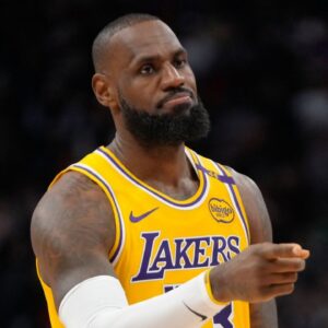 Los Angeles Lakers forward LeBron James (23) gestures to a teammate during the first half against the Toronto Raptors at Scotiabank Arena.